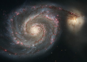 This beautiful Hubble Space Telescope image shows the Whirlpool Galaxy, which is interacting with the smaller galaxy on the right. Also known by its catalog number M51, the galaxy is in the constellation of Canes Venatici and is estimated to be roughly 23 million light years away.