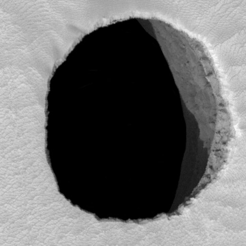 Cave opening in the Arsia Mons volcano on Mars